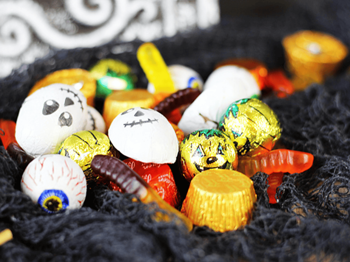 Closeup of candy skewers on a black fabric