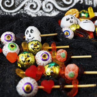 Candy skewers on a black fabric