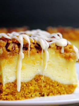 Delicious pumpkin bread with a layer of sweet cheesecake topped with crunchy pecans. Everything you could want in a Fall themed dessert and more. It's easy enough to remember the four ingredients and it works for when you don't need that super thick, rich cheesecake. The addition of the chopped pecans adds a crunchy element to the soft cake, and creamy cheesecake and icing layers.