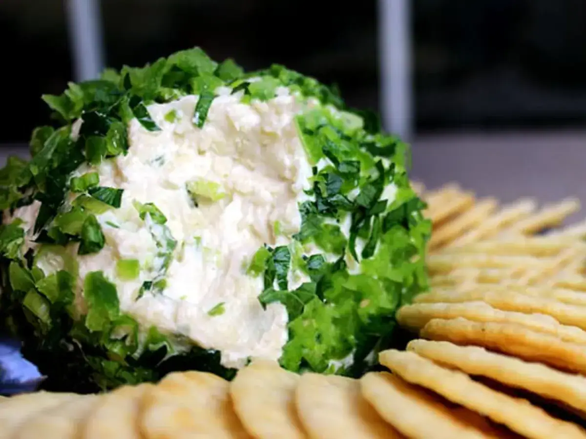 cheese ball with crackers on a plate