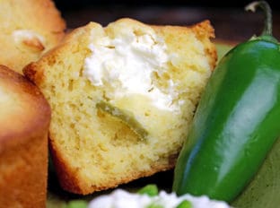 Fluffy buttermilk cornbread muffins filled with cream cheese and jalapenos make for a delicious jalapeno popper cornbread. Your chili or soup will never have tasted better!