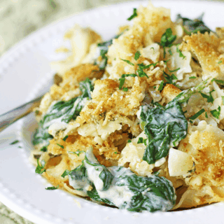 creamy veggies mixed with noodles on a plate
