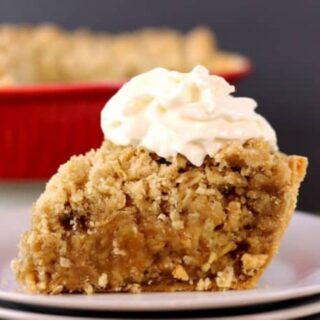 slice of apple crisp served in a pie crust