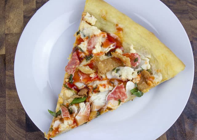 Pizza featuring crab, cream cheese, and crunchy wonton pieces.