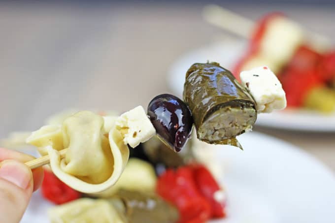 Your guests will love these cocktail party appetizers! Garlicky tortellini, stuffed grape leaves, feta, olives and peppers with almost no effort!