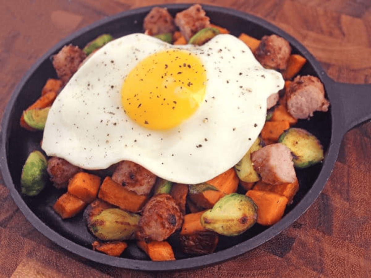 skillet filled with veggies, sausage, and egg