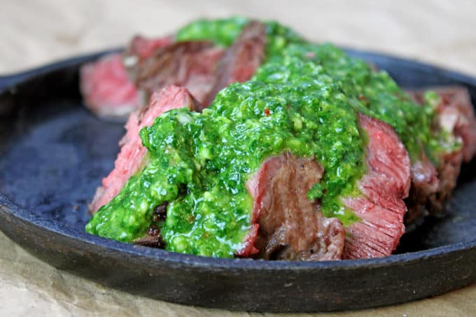 cast iron steak smothered in chimichurri ribeye sauce