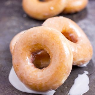 The Original Krispy Kreme Glazed Yeast Doughnut you know and love and now you can make them at home and eat them fresh! These doughnuts are best right after the glaze dries!