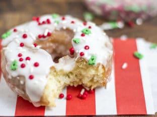 Classic Sour Cream Doughnuts fried to perfection with a classic powdered sugar glaze just like at Krispy Kreme! No yeast makes these doughnuts easy to make and with festive sprinkles a fantastic Holiday brunch/party treat!