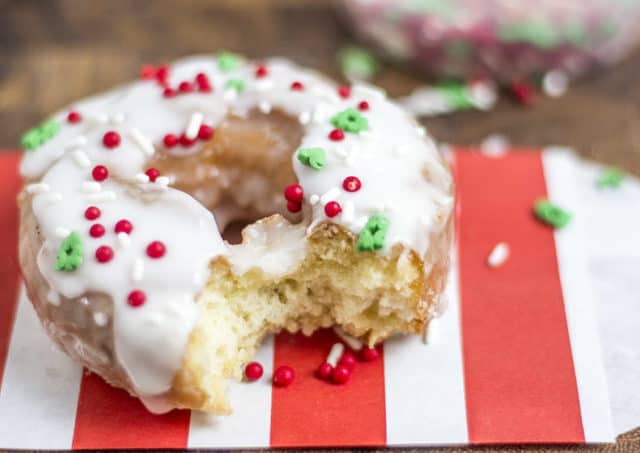 Glazed doughnut topped with festive sprinkles for the holidays.