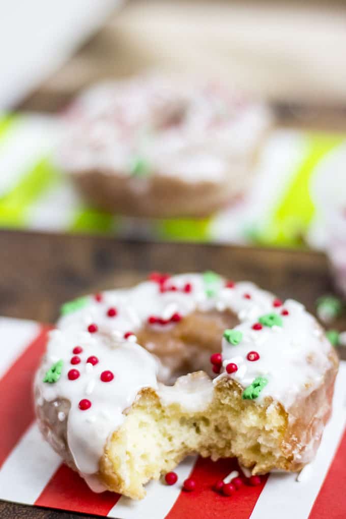 Classic Sour Cream Doughnuts fried to perfection with a classic powdered sugar glaze just like at Krispy Kreme! No yeast makes these doughnuts easy to make and with festive sprinkles a fantastic Holiday brunch/party treat!