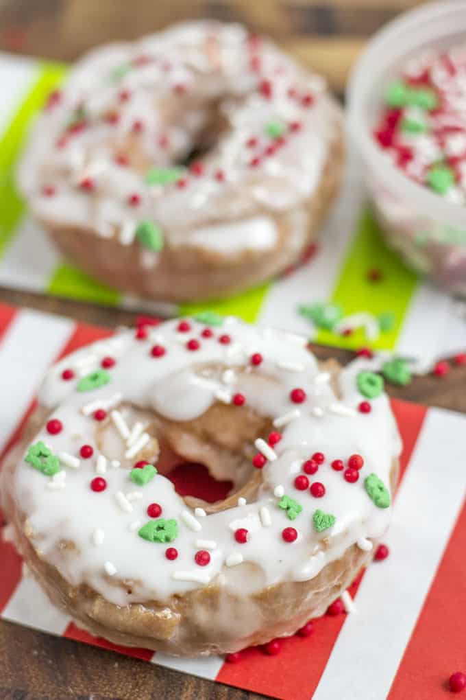 Classic Sour Cream Doughnuts fried to perfection with a classic powdered sugar glaze just like at Krispy Kreme! No yeast makes these doughnuts easy to make and with festive sprinkles a fantastic Holiday brunch/party treat!