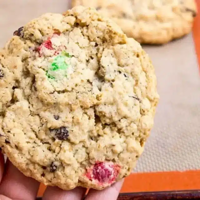 Holding Cookie above baking sheet