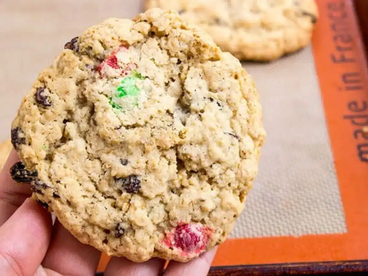 Holding Cookie above baking sheet