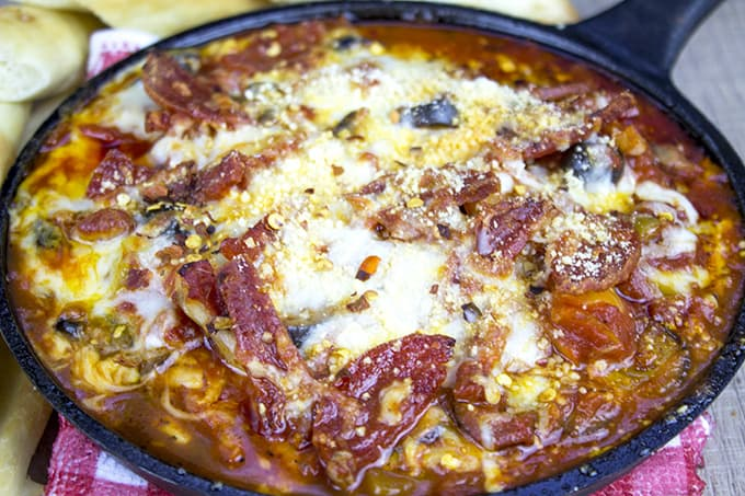 Homemade pizza dip with melty cheese topping
