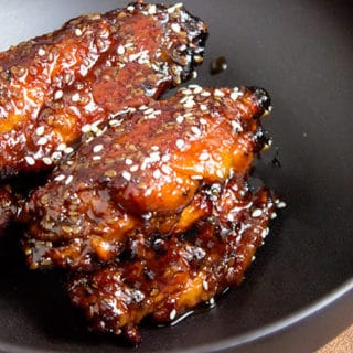 Sticky Asian chicken wings made with a hoisin take on a Mongolian beef marinade. They're sweet, savory, garlicky, just plain awesome and basically begging to be made for your Superbowl party!