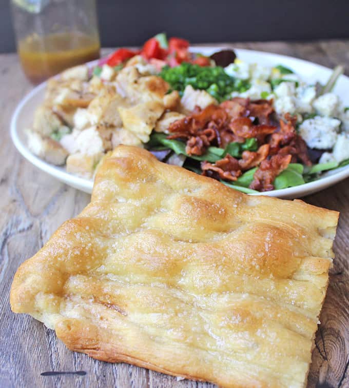 flat bread with salad in the background