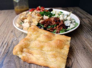 Cosi's top secret flatbread recipe that is thin, crispy and chewy with a deliciously buttery crisp crackled crust. Great for sandwiches and for serving with salads.