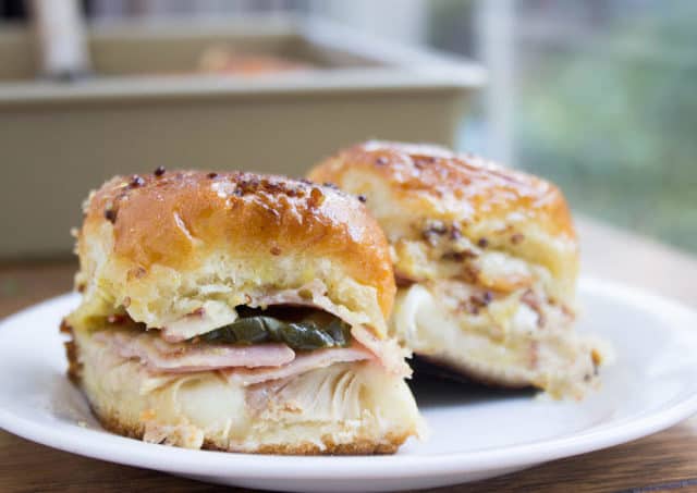 Sliders with roasted pork, ham, and mustard.