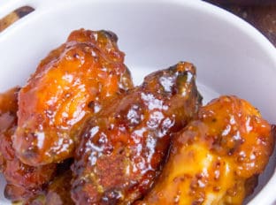 Tossed in a honey mustard and BBQ sauce, these chicken wings will be the hit of your game day party