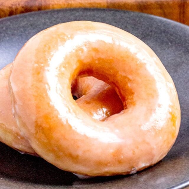 two donuts on plate.