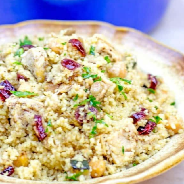 plate with couscous, vegetables and chicken