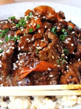Tender beef simmered in spicy garlic orange sauce with carrot ribbons. Tastes like a cross between orange beef and Mongolian beef!