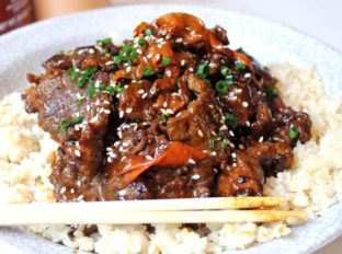 Tender beef simmered in spicy garlic orange sauce with carrot ribbons. Tastes like a cross between orange beef and Mongolian beef!