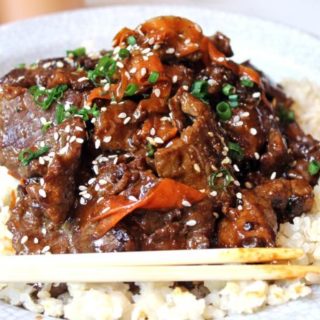Tender beef simmered in spicy garlic orange sauce with carrot ribbons. Tastes like a cross between orange beef and Mongolian beef!