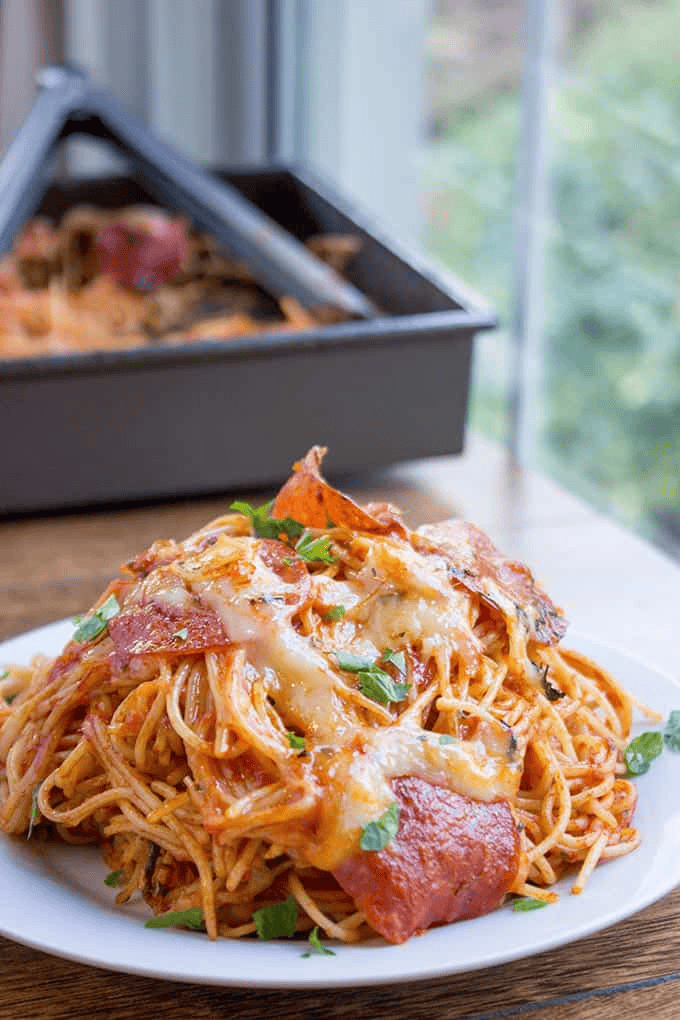 Plate of pasta with melted cheese and pepperoni