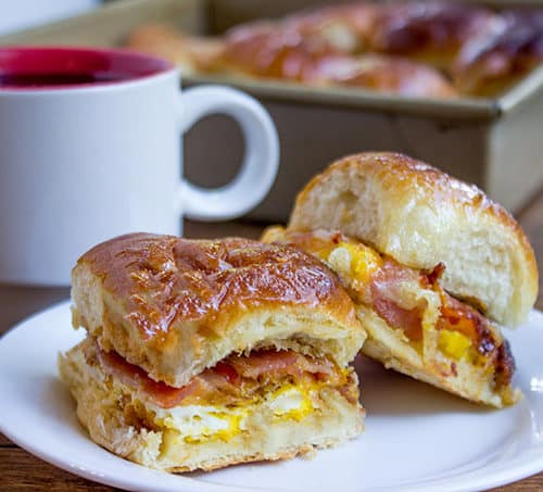 Baked Bacon Egg and Cheese Hawaiian Sliders are quick to make. They're a perfect make ahead and bake the morning of option for get togethers and can quickly serve a crowd!