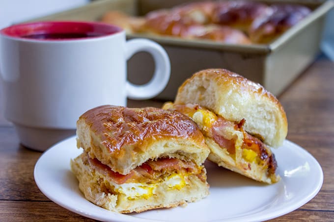 Baked Bacon Egg and Cheese Hawaiian Sliders are quick to make. They're a perfect make ahead and bake the morning of option for get togethers and can quickly serve a crowd!