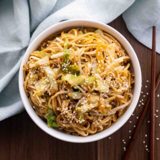 Classic Chinese Chow Mein in bowl with chop sticks