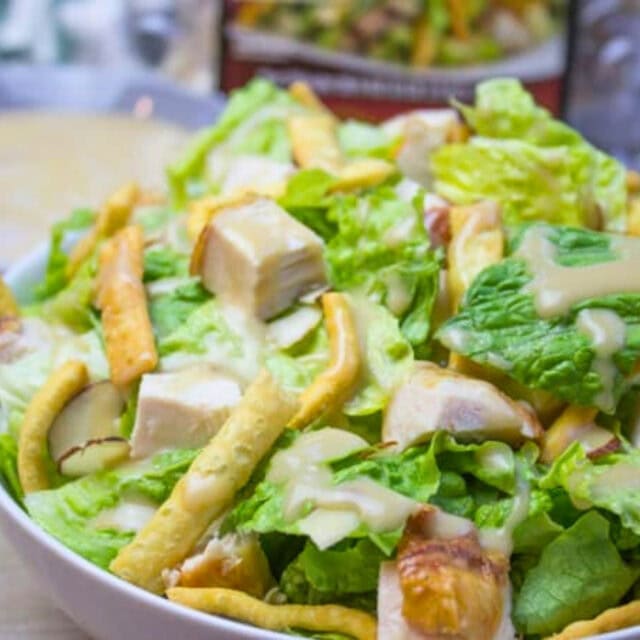 Dressed salad in white bowl