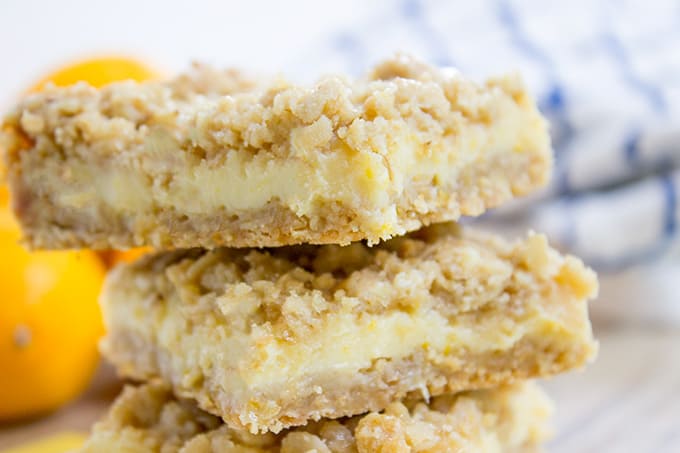 Easy Creamy Lemon Crumb Bars with a quick oatmeal crumb base and a sweet and tart creamy lemon filling.