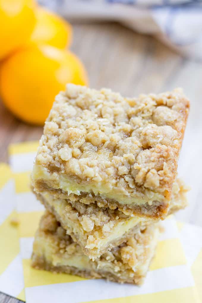 Easy Creamy Lemon Crumb Bars with a quick oatmeal crumb base and a sweet and tart creamy lemon filling.