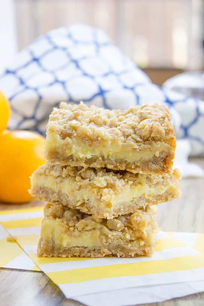 Easy Creamy Lemon Crumb Bars with a quick oatmeal crumb base and a sweet and tart creamy lemon filling.