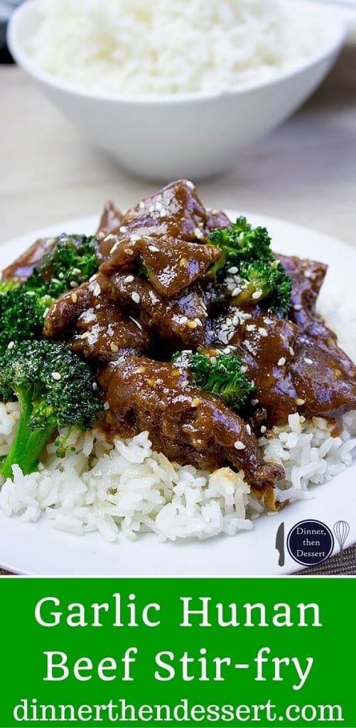 Garlic Hunan Beef finished served over rice on a plate.