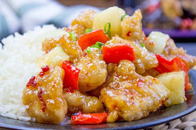 This copycat Panda Express Sweetfire Chicken Breast dish is made with crispy chicken with garlic, red bell peppers, onions and pineapples in a sweet and spicy chili sauce. A spot on copy!