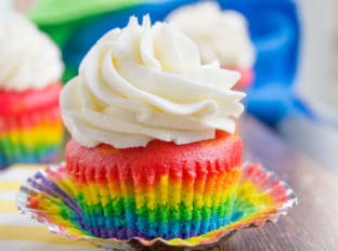 Rainbow Cupcakes with fluffy cloud-like vanilla frosting that is guaranteed to make anyone who sees them smile. No cake mix, still EASY.