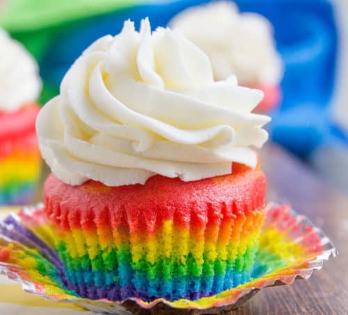 Rainbow Cupcakes with fluffy cloud-like vanilla frosting that is guaranteed to make anyone who sees them smile. No cake mix, still EASY.