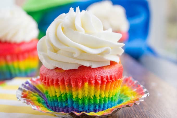 Rainbow Cupcakes with fluffy cloud-like vanilla frosting that is guaranteed to make anyone who sees them smile. No cake mix, still EASY.