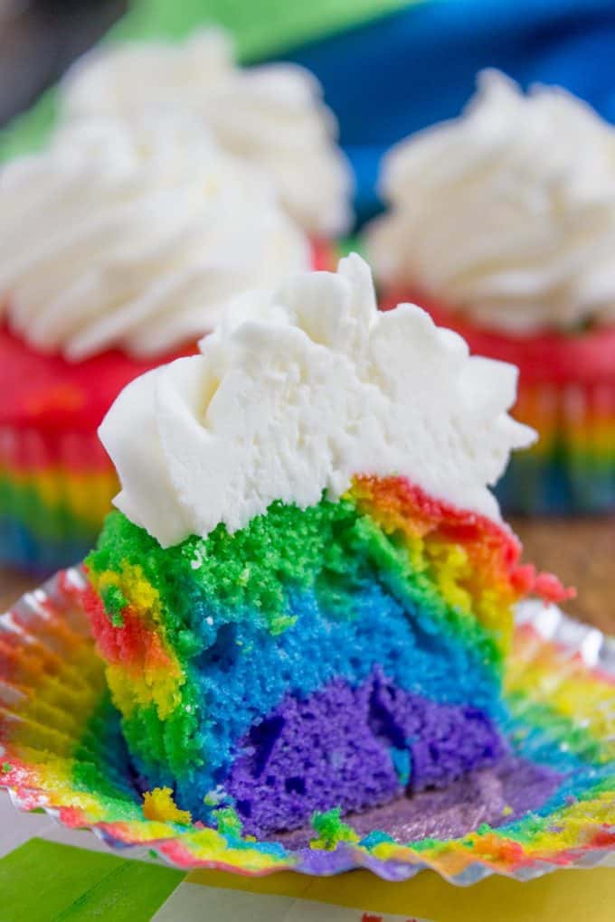 Rainbow Cupcakes with fluffy cloud-like vanilla frosting that is guaranteed to make anyone who sees them smile. No cake mix, still EASY.