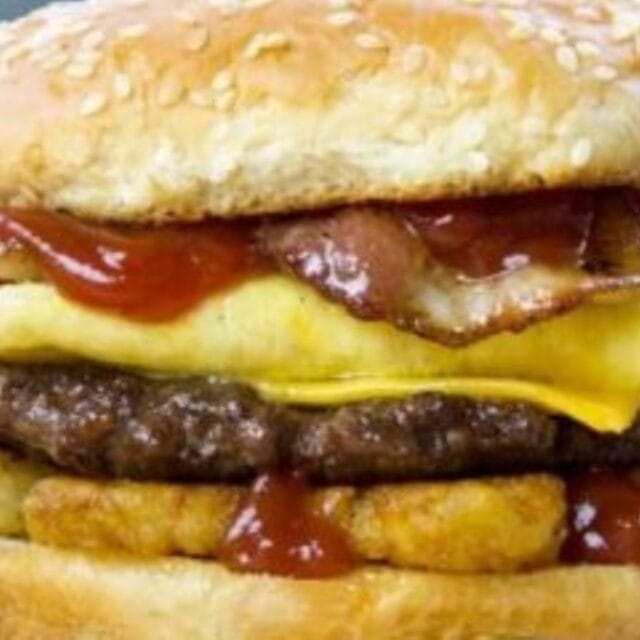 Burger with cheese, bacon and egg