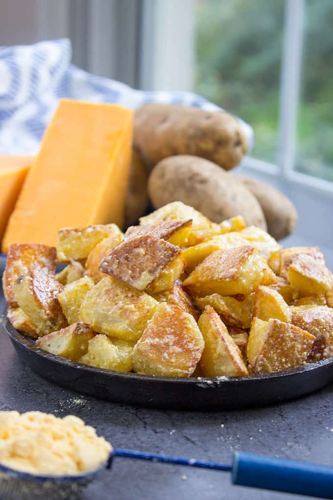 Cheddar and Sour Cream Roasted Potatoes have all the flavors of Cheddar and Sour Cream Potato Chips on freshly roasted potatoes! Made with 100% natural powdered cheddar and sour cream and totally craveable!