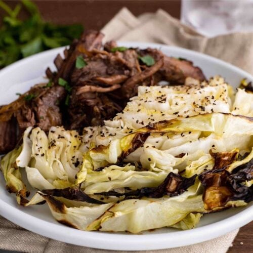 Roasted Cabbage round Steaks on plate with beef