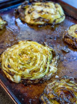 Crispy Roasted Cabbage Steaks make a great side dish for any meal (not just your favorite Corned Beef) in just 20 minutes. You'll never boil cabbage again.