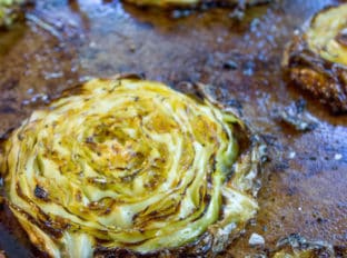 Crispy Roasted Cabbage Steaks make a great side dish for any meal (not just your favorite Corned Beef) in just 20 minutes. You'll never boil cabbage again.
