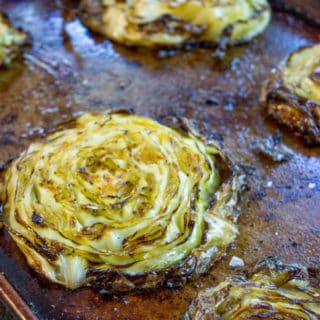 Crispy Roasted Cabbage Steaks make a great side dish for any meal (not just your favorite Corned Beef) in just 20 minutes. You'll never boil cabbage again.
