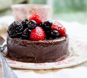 Flourless Mocha Cake with Creme Anglaise will leave your guests thinking it came from a bakery or restaurant. Dense mocha cake with vanilla cream is like the best coffee and cream dessert you've ever had.